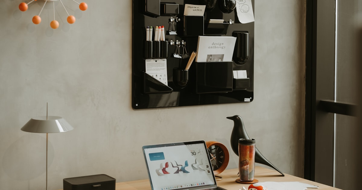A modern, organized workspace with a laptop on a clean desk, illustrating a streamlined prompt workflow.