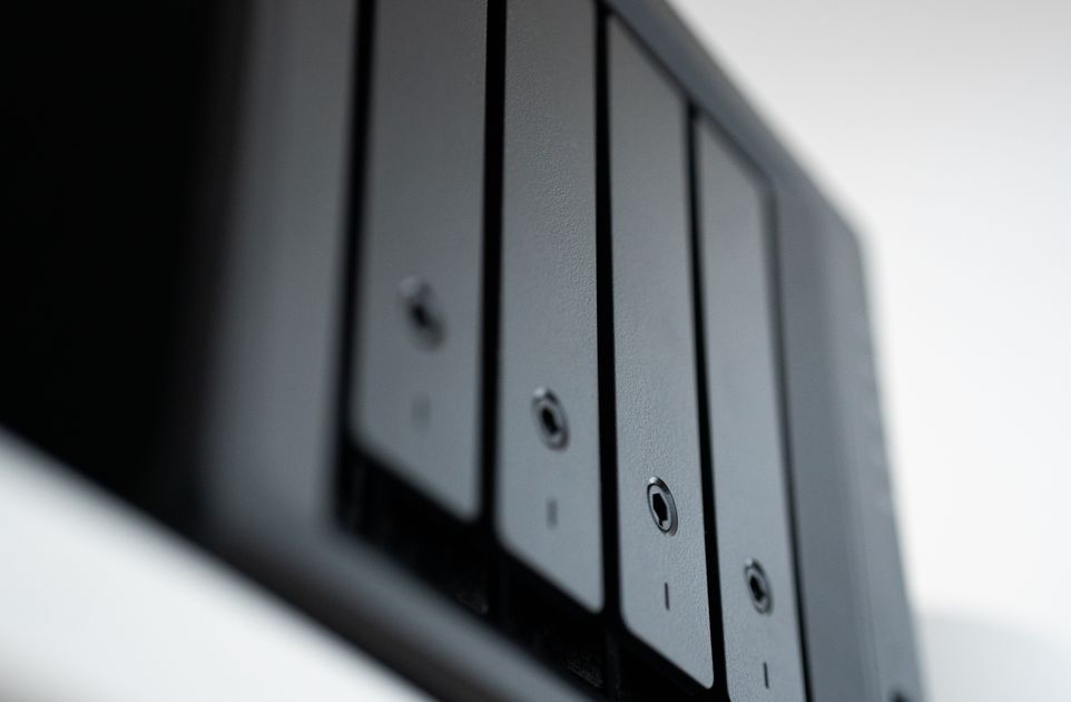 Close-up of a network data hub and storage device, illustrating where digital conversations are saved and backed up.